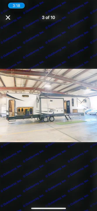 Spacious Sabre fifth-wheel RV for rv rental, seen indoors with slide-outs extended, ready for travel.. Forest River Sabre 2022