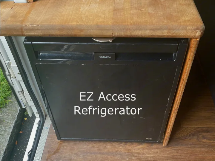 Inside an RV rental, discover this built-in Dometic refrigerator for EZ access, perfect for convenient food storage.. Ford Econoline 2011