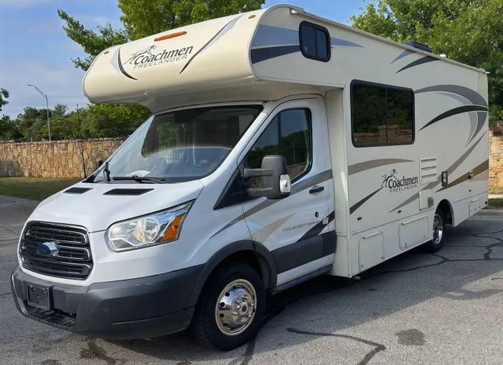 A white Coachmen Freelander RV, built on a Ford Transit chassis, parked outdoors. Perfect for an RV rental.. Forest River Coachmen Freelander Micro 2018