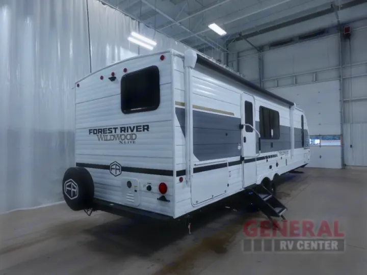 This white Forest River Wildwood X-Lite travel trailer is displayed for rv rental.. Forest River 26Ice 2025