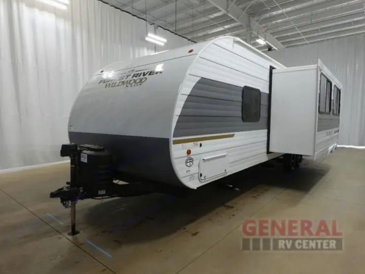 Spacious Forest River Wildwood travel trailer, ideal for your next RV rental adventure, featuring a convenient slide-out.. Forest River 26Ice 2025