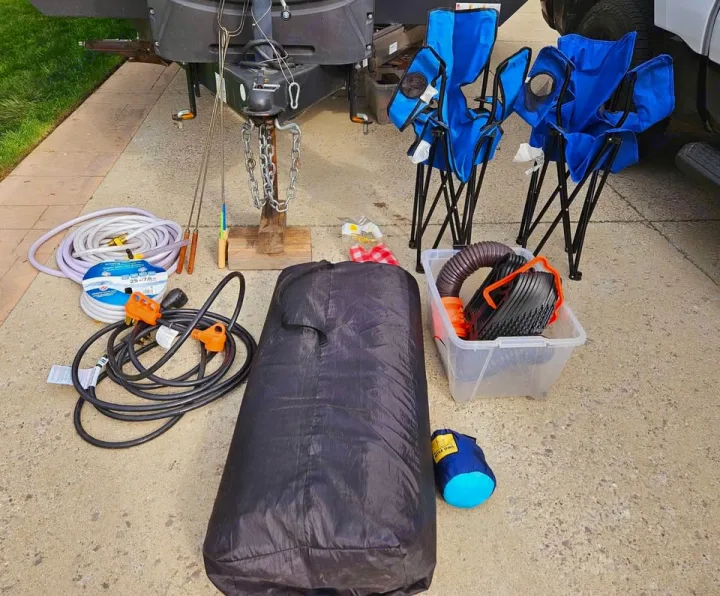 RV rental essentials: camping chairs, water hoses, power cords, sewer kit, and campfire skewers.. Forest River Tracer Breeze 2020