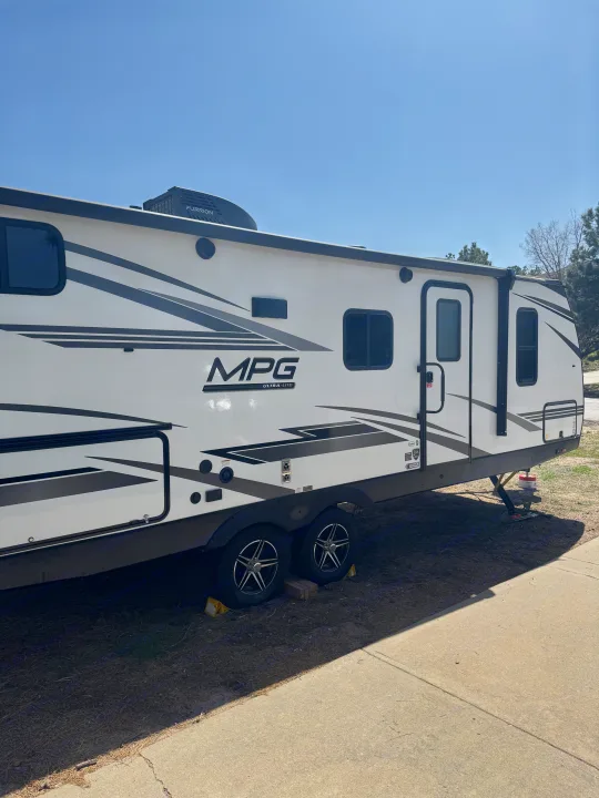 This MPG Ultra-Lite travel trailer is parked, ready for your next RV rental. Ideal for camping and outdoor adventures!. Cruiser RV MPG 2500BH 2024