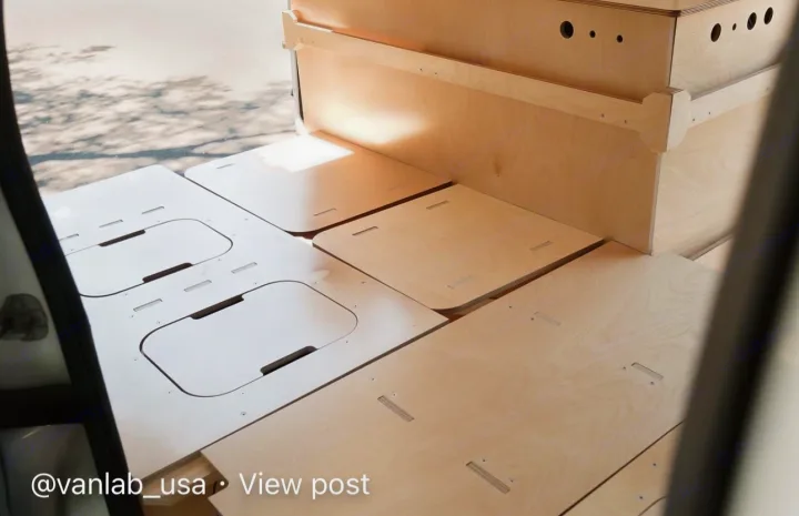 Modular plywood interior of an RV rental, featuring clever floor storage panels and custom cabinetry. Ideal for camper van adventures.. Ram Promaster City 2018