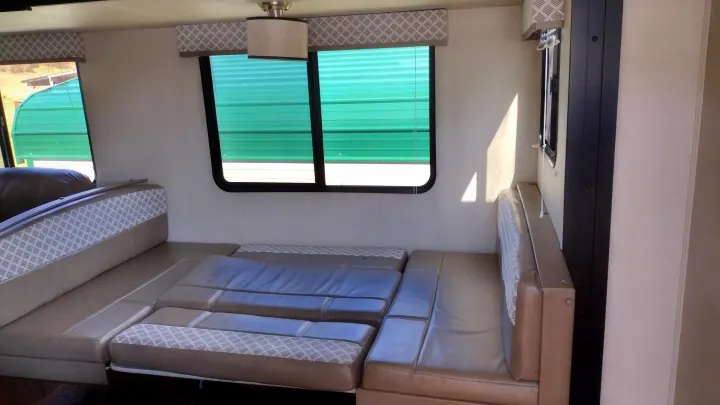 Spacious RV rental dinette converts to a comfortable bed, perfect for your next camper adventure. Bright interior with windows.. Avenger ATI 2019
