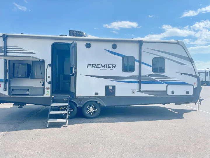 Modern Premier travel trailer RV rental with open outdoor kitchen and steps.. Keystone RV Bullet Premier Ultra Lite 2022