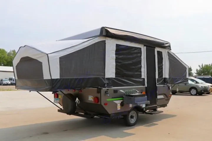 This pop-up camper is set up for your next RV rental adventure, featuring extended tent ends and an awning.. Rockwood Freedom Series 2022