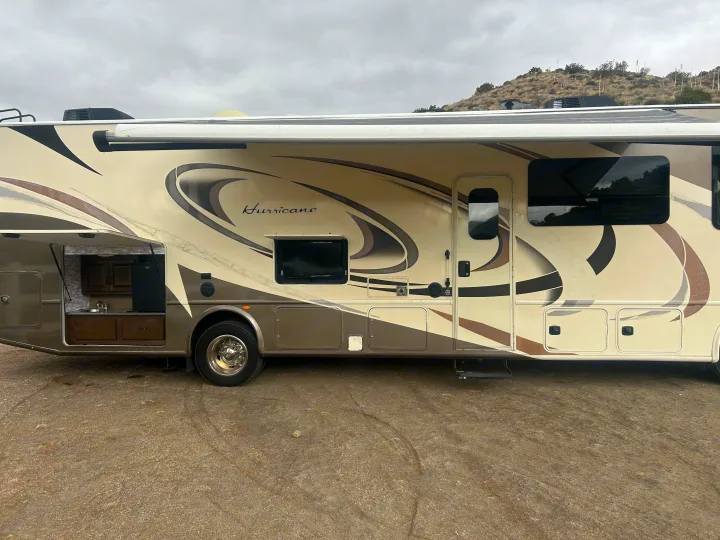 Spacious Class A Hurricane RV rental ready for adventure. Features an outdoor kitchen & TV, perfect for travel & camping.. Thor Hurricane 2018