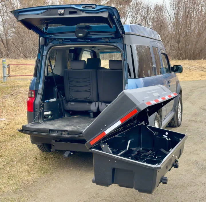 Blue Honda Element SUV with open trunk and black hitch cargo box, ideal for extra storage on an RV rental trip.. Honda Element Ecamper 2008