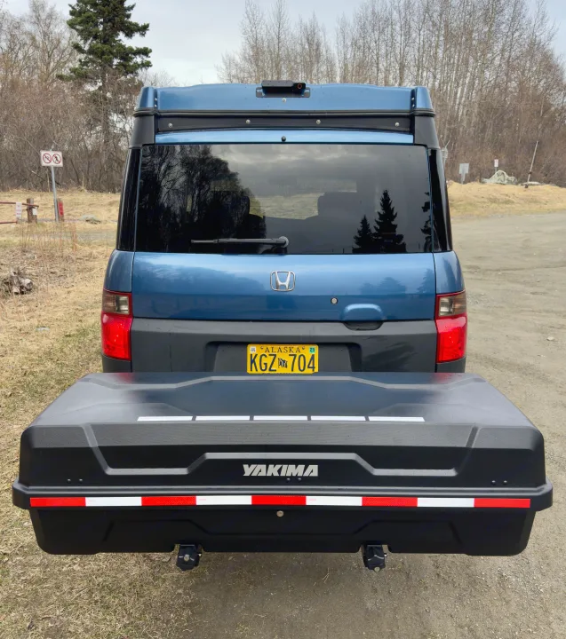 Blue Honda Element RV rental with a Yakima cargo box at the rear, perfect for outdoor adventures in Alaska.. Honda Element Ecamper 2008