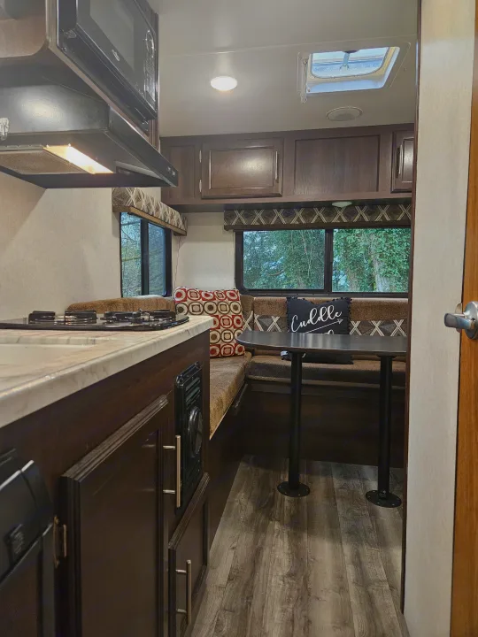This cozy RV rental features a compact kitchen, a comfortable dinette, and scenic window views.. Jayco Jay Flight SLX 2019