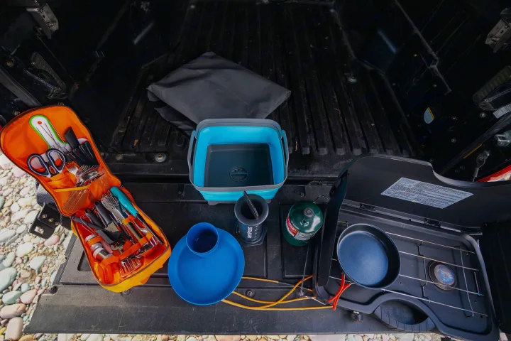 RV rental ready: Truck bed full of essential camping kitchen gear, like stove, Aeropress, and organized utensils.. Toyota Tacoma TRD Off Road 2017