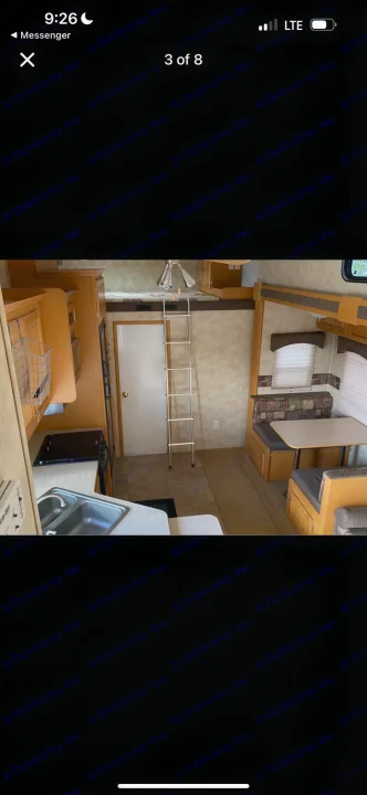 Inside an RV rental: full kitchen with sink, dinette seating, and ladder to an upper bunk. Ready for your road trip!. Heartland RVs Cyclone Toy Hauler 2008