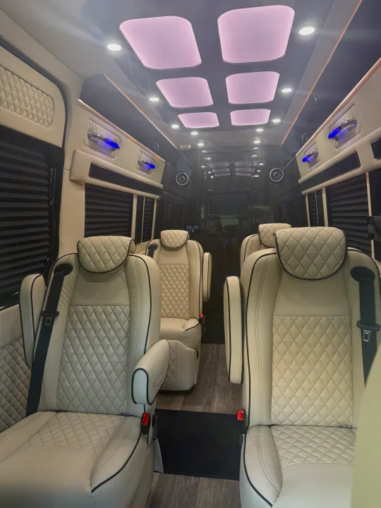 Experience luxury RV rental travel! Spacious interior with plush cream captain's chairs, ambient lighting, and premium finishes.. Mercedes-Benz Sprinter 2025