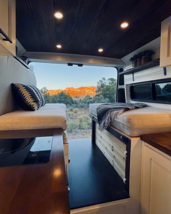 This cozy RV rental provides stunning desert mountain views from its open rear doors for your van life journey.. Dodge Ram 1500 2019
