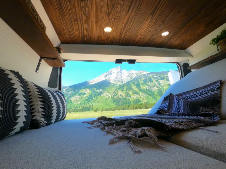 Experience serene van life! This cozy RV rental offers stunning mountain views from a comfortable interior. Perfect nature escape.. Dodge Ram 1500 2019