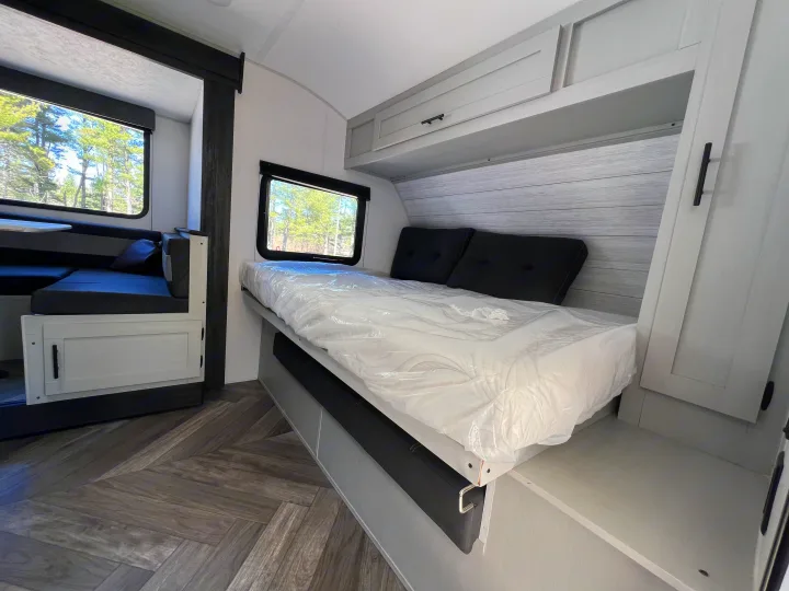 Modern RV rental features a cozy bedroom with storage & dinette area. Enjoy comfortable travels.. Forest River Salem FSX 2021