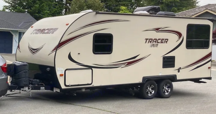 Beige Tracer Air travel trailer, perfect for RV rental trips. Hooked up & ready for your next adventure.. Tracer Tracer Air 2017