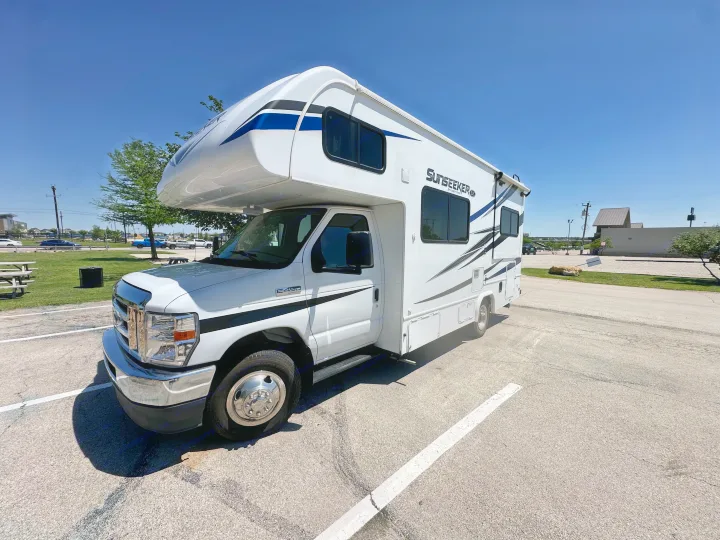 White Class C Sunseeker by Forest River RV rental, parked under a clear blue sky.. Forest River Sunseeker LE 2021
