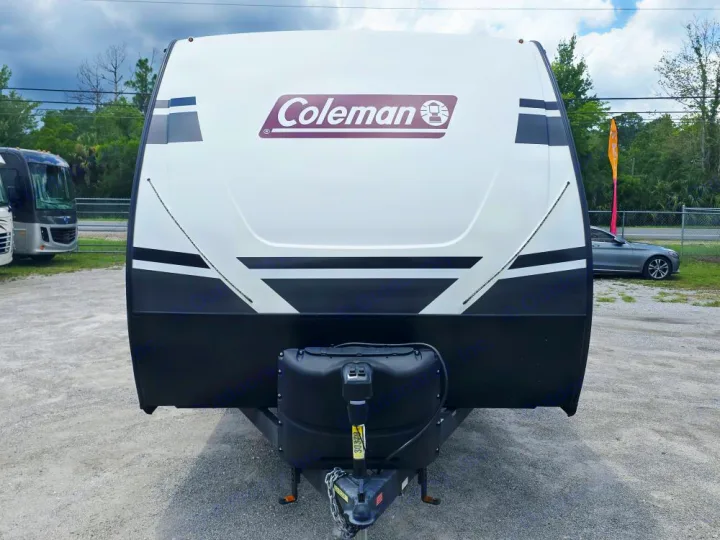 Front view: white & black Coleman travel trailer, ready for RV rental adventures.. Coleman 1855RB 2022