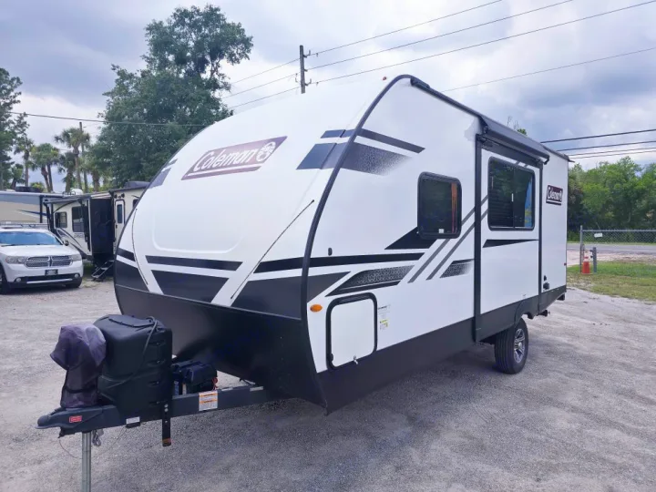 Sleek white & black Coleman travel trailer, ideal for your next RV rental or camping adventure.. Coleman 1855RB 2022