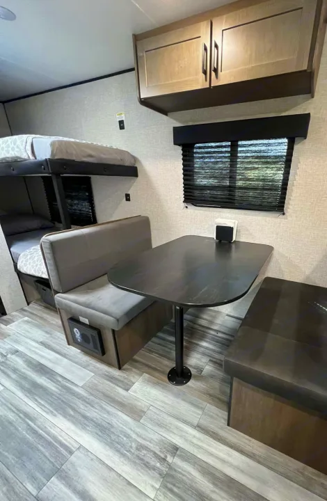 This RV rental features a cozy dinette, bunk beds, and overhead storage. Ideal for comfortable family trips.. Jayco Jay Flight SLX 170BHW 2025