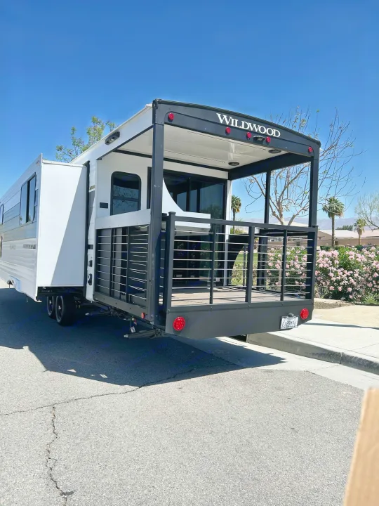 Wildwood RV rental with a unique patio deck. This travel trailer offers great outdoor living space.. Forest River RV 34VERANDA 2025