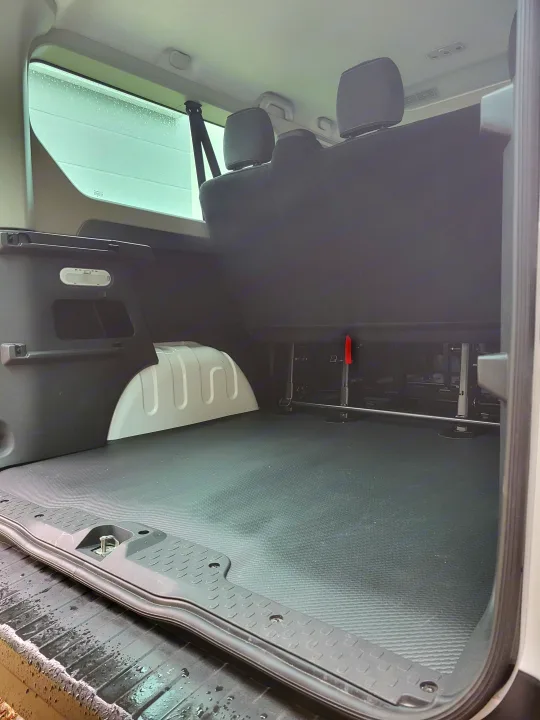 Discover this versatile rv rental van's interior: spacious cargo area, durable floor, & comfortable rear seats.. Renault Trafic 2025