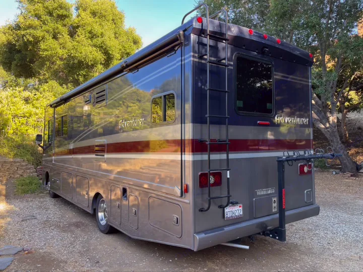 This modern Winnebago Adventurer RV, available for rv rental, offers a sleek design with a bike rack for your road trip.. Winnebago Adventurer 2021