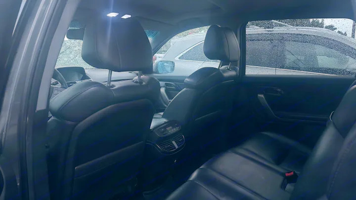 View from car's rear seats on a rainy day, showing interior space. Consider this comfort for your next rv rental trip.. Other Other 2007