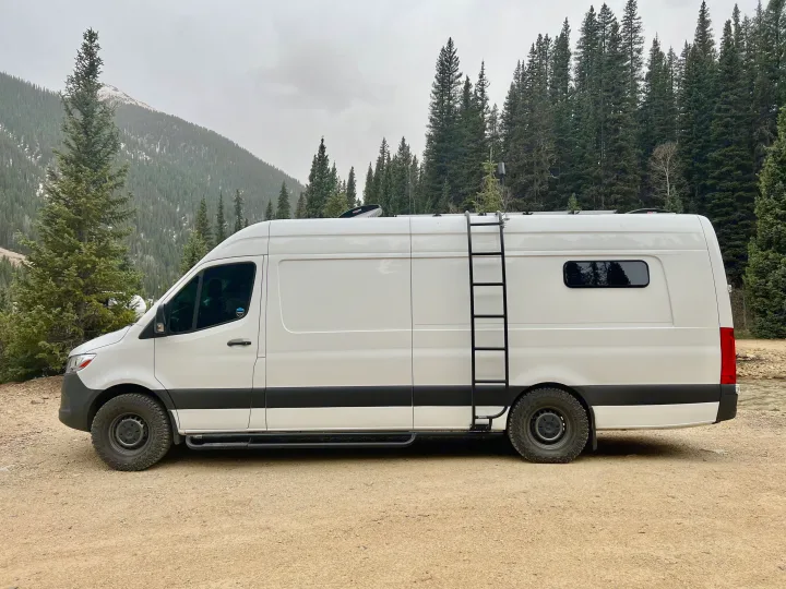 Explore the outdoors in this rugged white Mercedes Sprinter camper van, a great RV rental for mountain adventures.. Mercedes-Benz Sprinter 2020