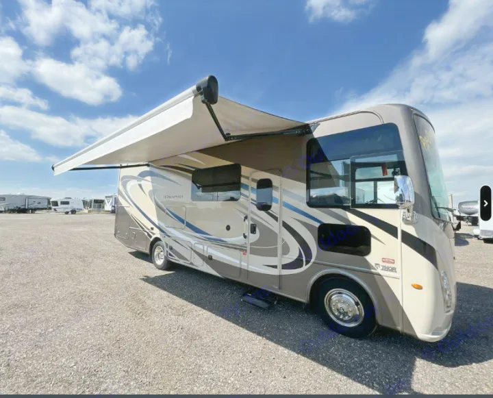This beige Thor motorhome, perfect for an rv rental, features an extended awning for shade and comfort.. Thor Windsport 2019