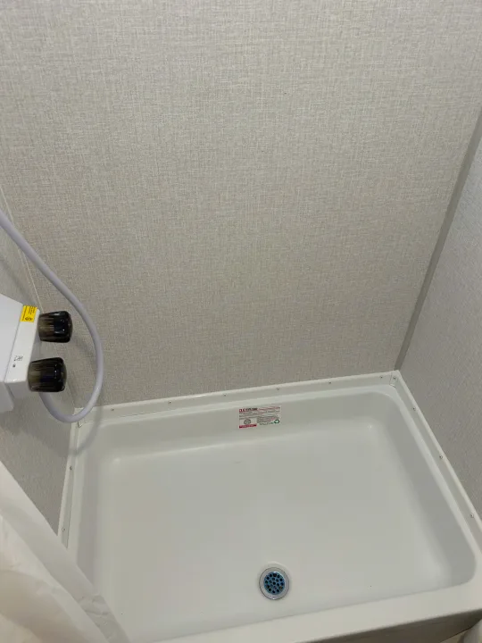 Clean, compact shower in an RV rental, with a white base, textured walls, and visible shower head/drain.. Clipper 17CBHCADET 2024