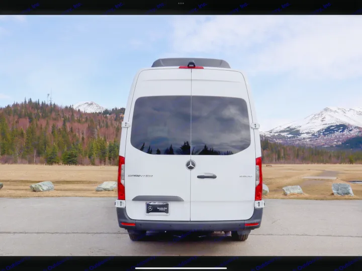 Rear view of a white Mercedes Sprinter van. Perfect for rv rental trips to explore mountains & nature.. Mercedes- Benz Sprinter 2025