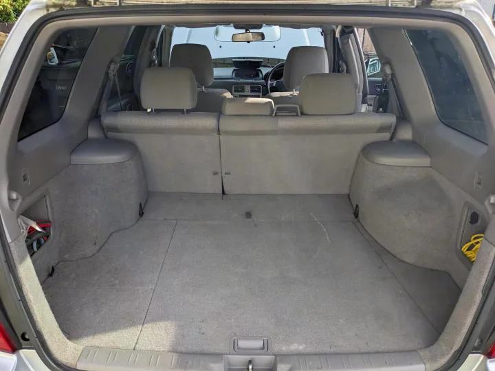 Car's tidy cargo area, ideal for packing essentials. Prepare for your RV rental adventure.. Subaru Forester 2007