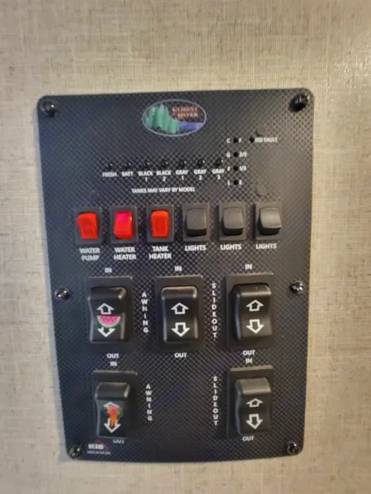 RV rental control panel showing tank levels (Fresh, Black, Gray, Battery), water pump/heaters, lights, awning, and slideout controls.. Forest River Salem Hemisphere 2021