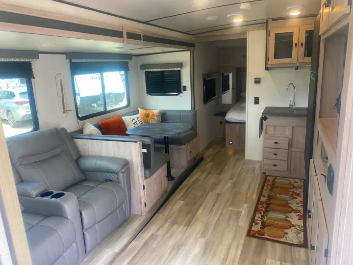 Bright and modern RV rental showing living room, dinette, kitchen, and bedroom access.. Coachmen Northern  Spirit Ultra Lite 2024
