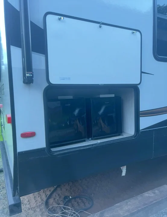 This RV rental features a spacious outdoor storage bay, housing two Hotpoint mini-fridges for convenient outdoor living.. Keystone RV Sprinter Campfire Edition 2021