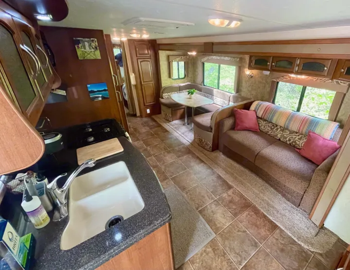 This RV rental offers a full kitchen, U-shaped dinette, and cozy sofa, great for adventures.. Coachmen Freedom Express 2013