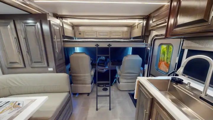 Modern RV rental interior: cockpit, cab-over bed, kitchen with sink, cozy sofa, ample storage. Ready for adventure!. Georgetown GT7 2022