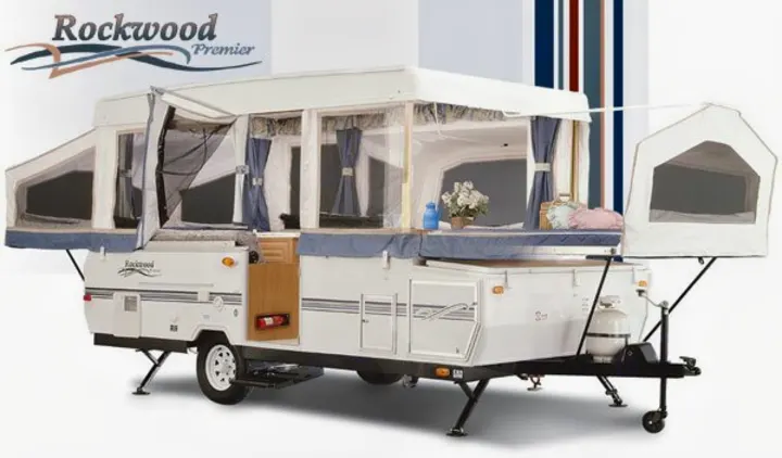 Explore the outdoors with this Rockwood Premier pop-up trailer RV rental, featuring expanded living space for camping.. Forest River Rockwood Premier 2004