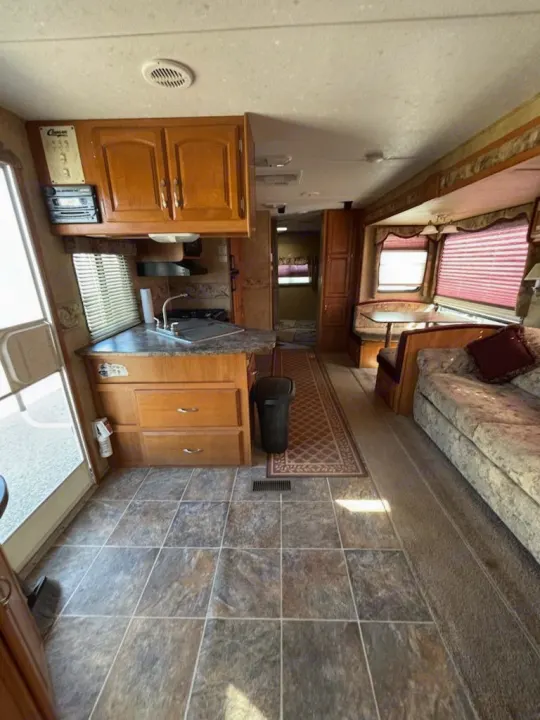 This rv rental offers a well-equipped kitchen with a sink & stovetop, plus a comfortable dinette and sofa.. Keystone RV Cougar 2008