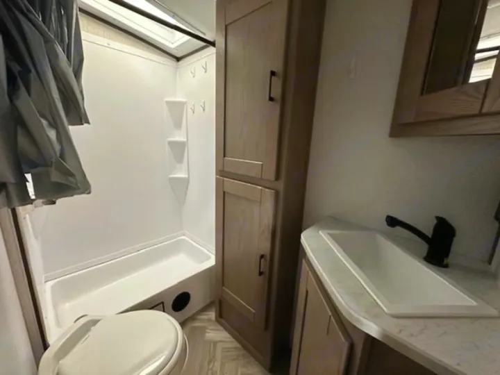 RV rental bathroom: compact design with shower, toilet, sink, & tall storage. All you need for your adventure.. Cruiser RV Shadow Cruiser 2019
