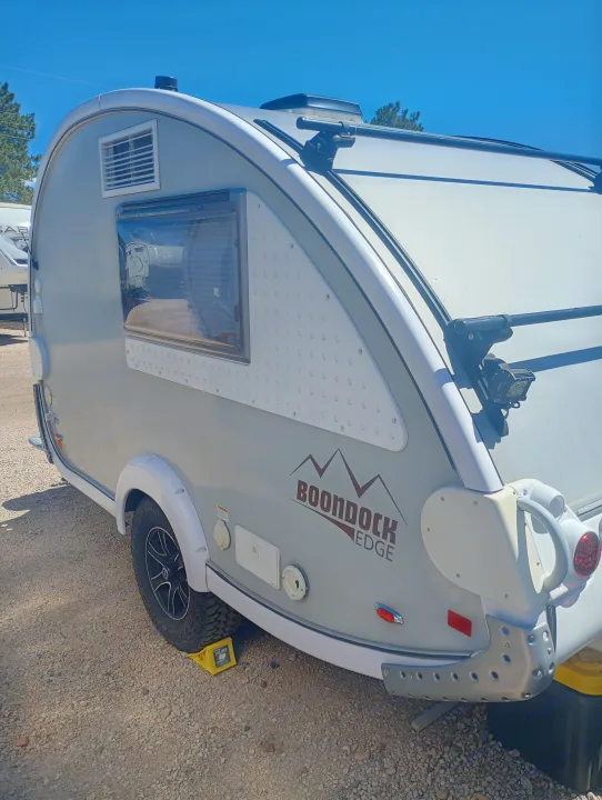 This light-colored Boondock Edge teardrop RV rental, perfect for outdoor adventures, is ready for your trip.. nuCamp T@B 2019