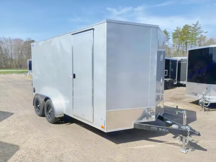 View a silver enclosed utility trailer, a versatile option for cargo transport or storage with your RV rental. Durable design.. ITI Cargo 7X14 2025