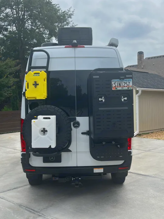 This Sprinter van RV rental is adventure-ready, featuring a rear-mounted spare tire, extra fuel/water containers, and utility storage.. Thor Tranquility 2023