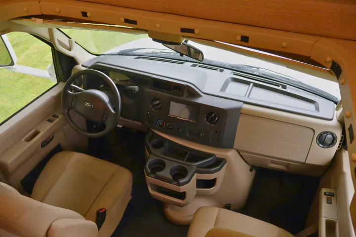 RV rental: Interior view of the spacious driver's cabin, featuring the dashboard, steering wheel, and comfy front seats.. Other Freelander 2016