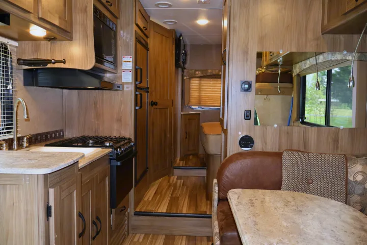 Spacious RV rental interior with full kitchen, dining area, & comfortable amenities. Perfect for your next adventure!. Other Freelander 2016