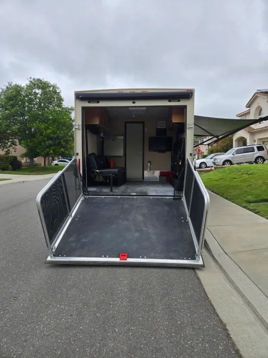 Toy hauler RV rental: rear ramp open, revealing versatile interior space.. Thor Outlaw 2016