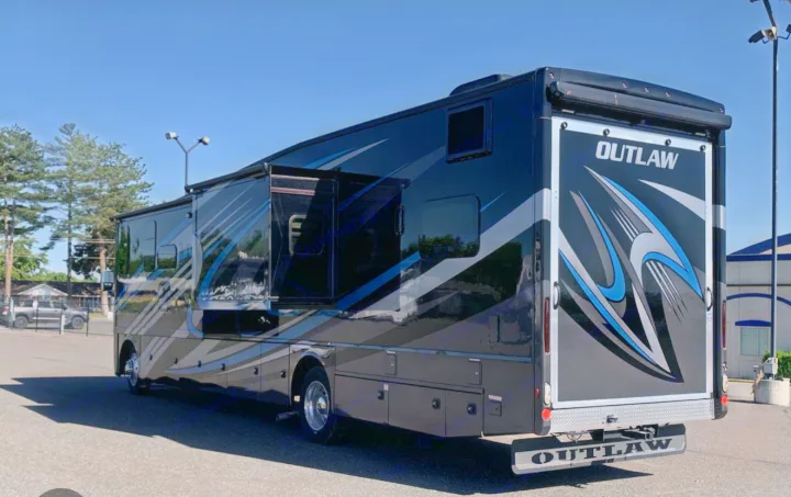 Sleek black 'Outlaw' motorhome with blue accents, ready for your next RV rental travel adventure.. Thor Outlaw 2022